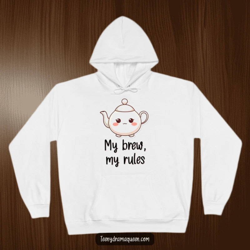 Funny teapot character hoodie, very small, expressive, tiny raised spout, perfect for cozy, cheerful moments.